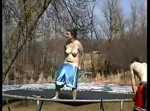Couple fucking on a trampoline.